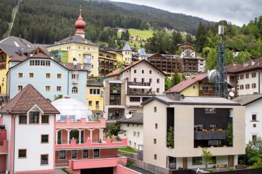 Historical buildings in Ortisei, Italy clipart