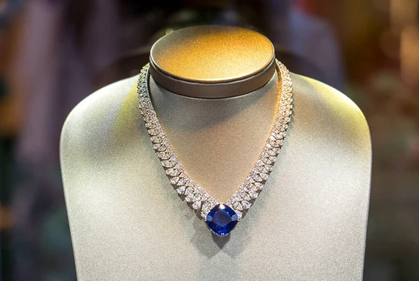 Luxury diamond necklace on dummies in showcase of boutique