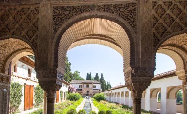 Stone arches in the world-famous garden of the Alhambra, Andalucia, Granada, Spain