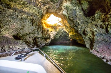 Boat tour inside of the grotto in Ponta de Piedade, Portugal