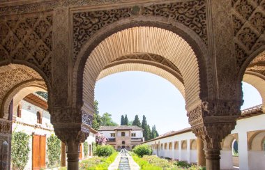 Stone arches in the world-famous garden of the Alhambra, Andalucia, Granada, Spain