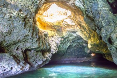 Boat tour inside of the grotto in Ponta de Piedade, Portugal
