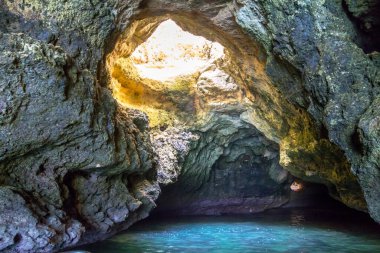 Boat tour inside of the grotto in Ponta de Piedade, Portugal