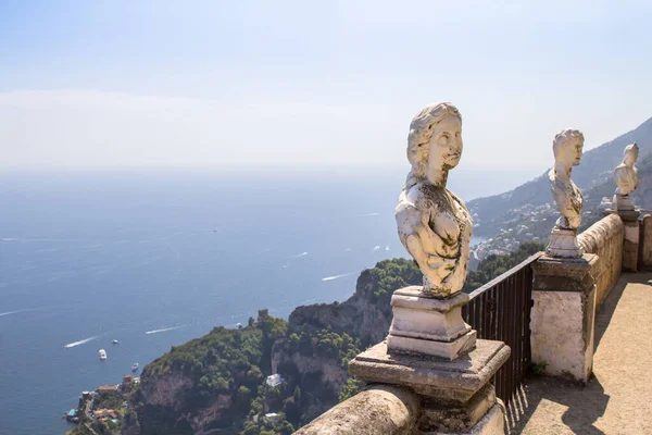 Stone statues on sunny Terrace of Infinity in Villa Cimbrone above the sea in Ravello, Amalfi Coast, Italy