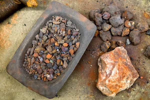 Red crushed iron ore on the ground — Stock Photo, Image