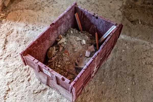 Box with debris after construction work — Stock Photo, Image