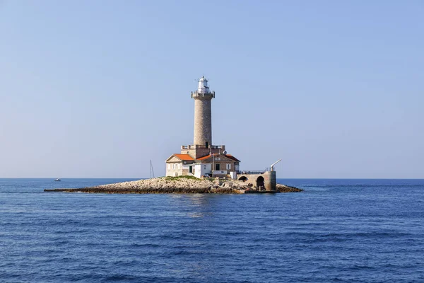 old stone lighthouse on small island