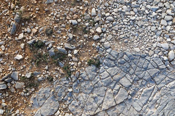 Superficie de piedra áspera como textura de fondo — Foto de Stock