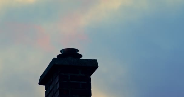 Smoking chimney on rooftop closeup footage — Stockvideo
