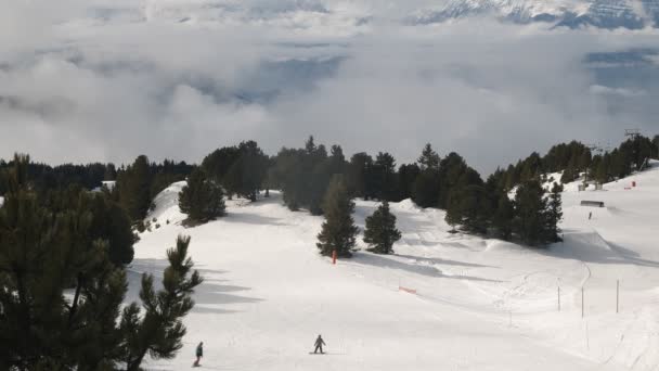 Part of ski resort from above with people skiing — Stockvideo