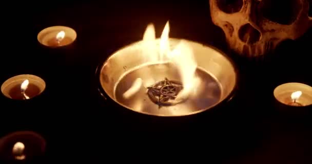 Burning pentacle on altar closeup footage — Stockvideo