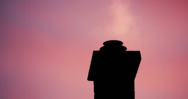 Smoking chimney on rooftop closeup footage — Stockvideo