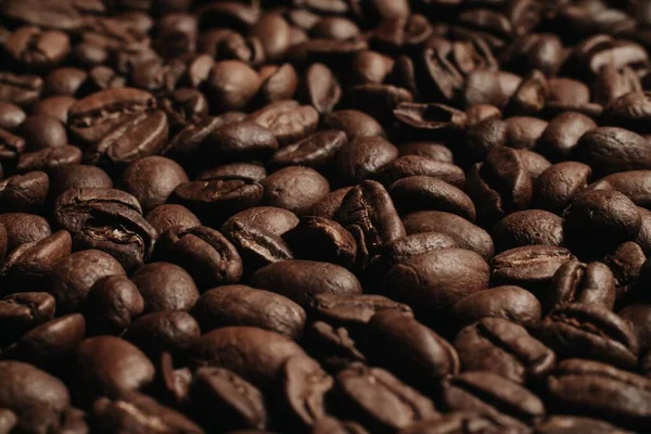 roasted coffee beans, can be used as background. Coffee production concept for coffee shop. Grains after roasting.