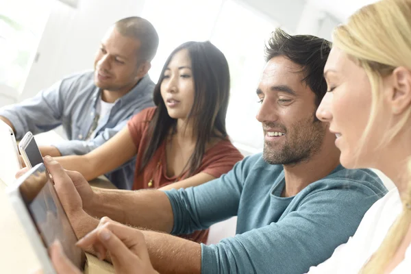 People meeting with tablets and smartphones — Stock Photo, Image