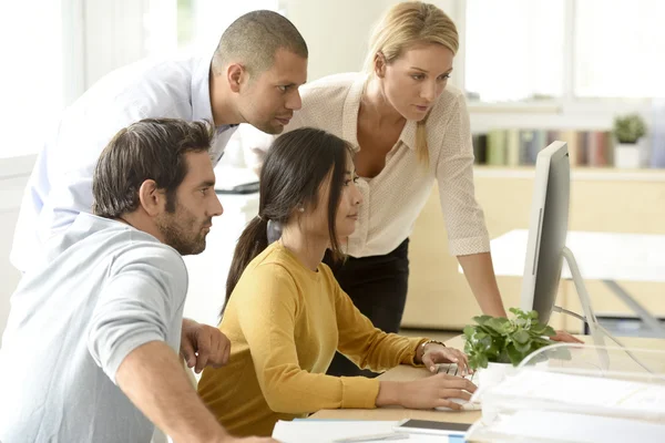 Team working together on desktop — Stock Photo, Image