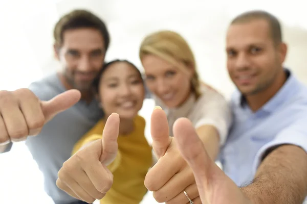 People showing thumbs up to camera — Stock Photo, Image