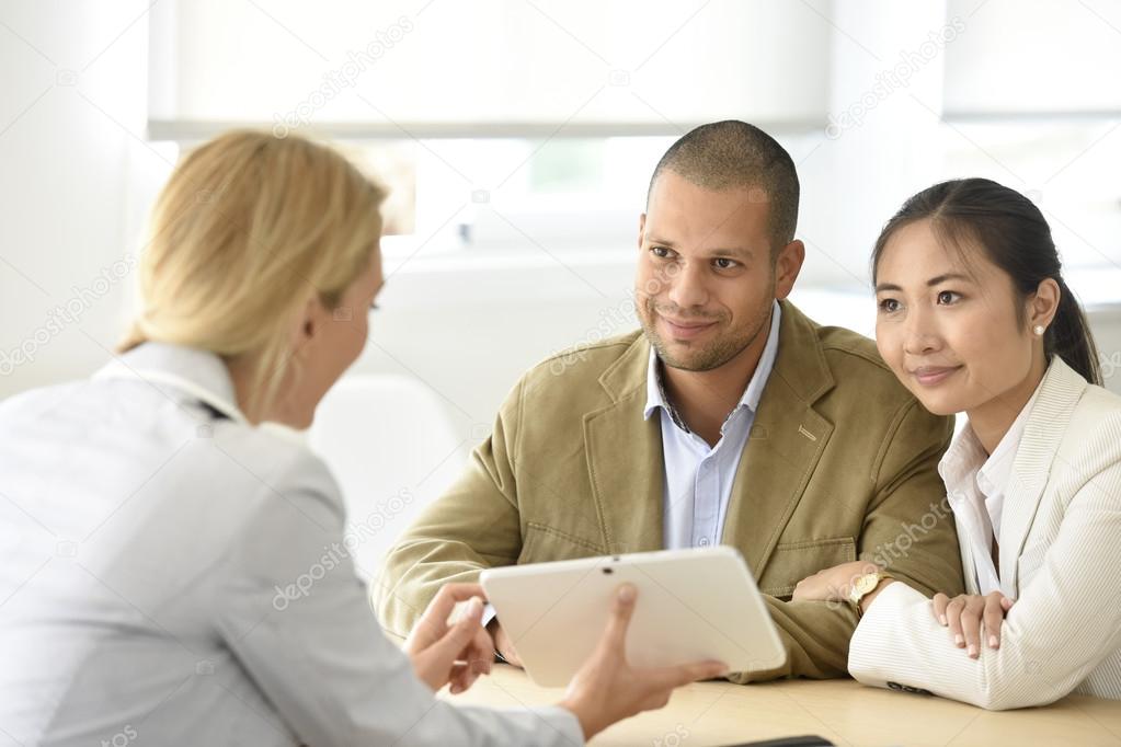  couple meeting financial adviser 