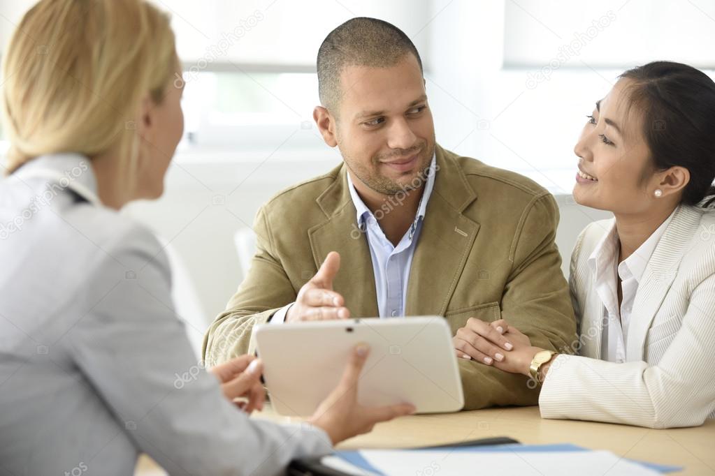  couple meeting financial adviser 