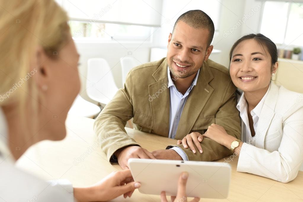  couple meeting financial adviser 