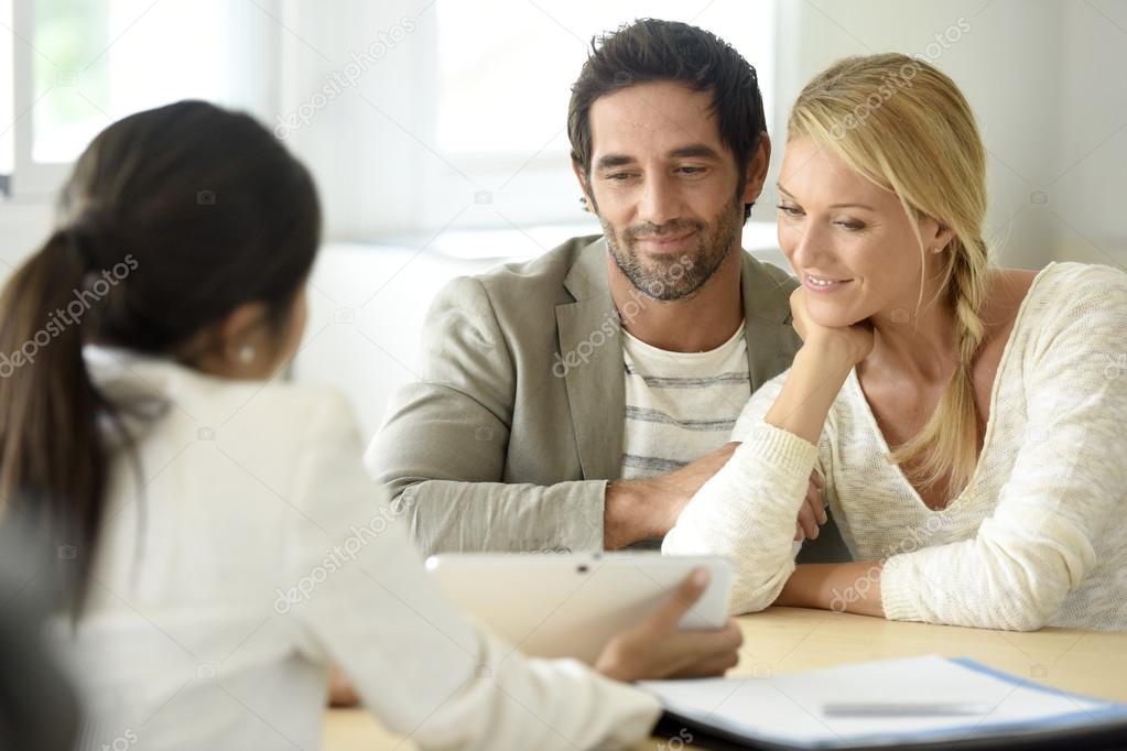  couple meeting financial adviser 