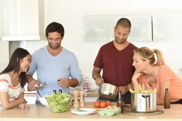 Friends having fun cooking meal — Stock Photo, Image