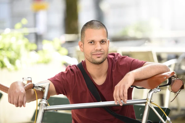 Man with bicycle sitting — Stock Photo, Image