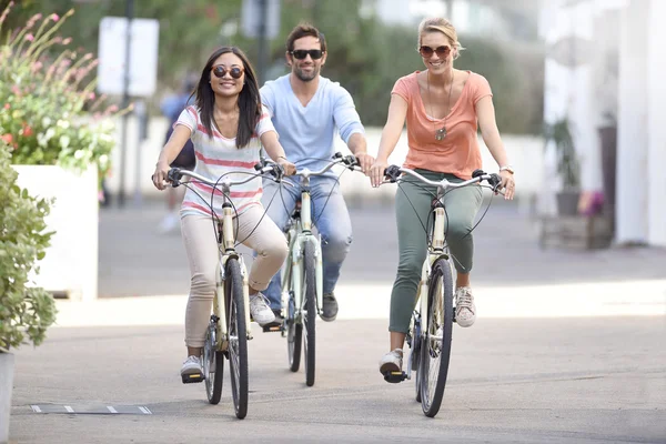 People on vacation riding bicycles — Stock Photo, Image