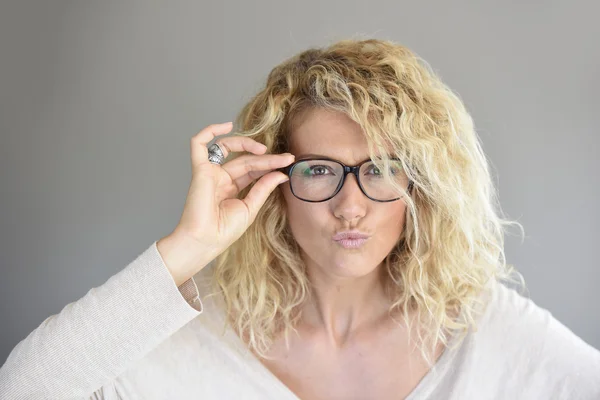 Woman with eyeglasses on being expressive — Stock Photo, Image