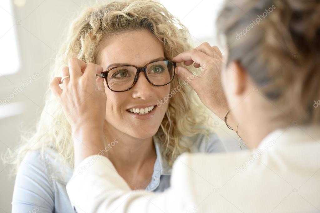 woman  trying eyeglasses on