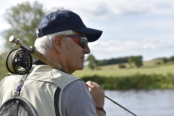 Vlieg-fisherman te wachten met hengel — Stockfoto