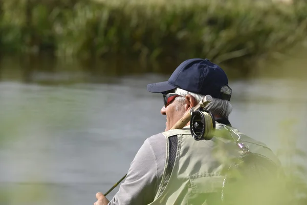 Mouche-pêcheur attendant avec canne à pêche — Photo