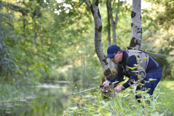 Fisherman fishing  from riverbanks