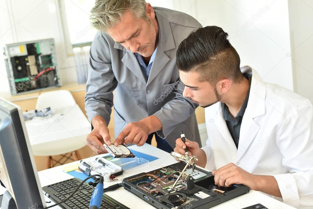 Student in electrical engineering course training Stock Photo by ©Goodluz  128840974