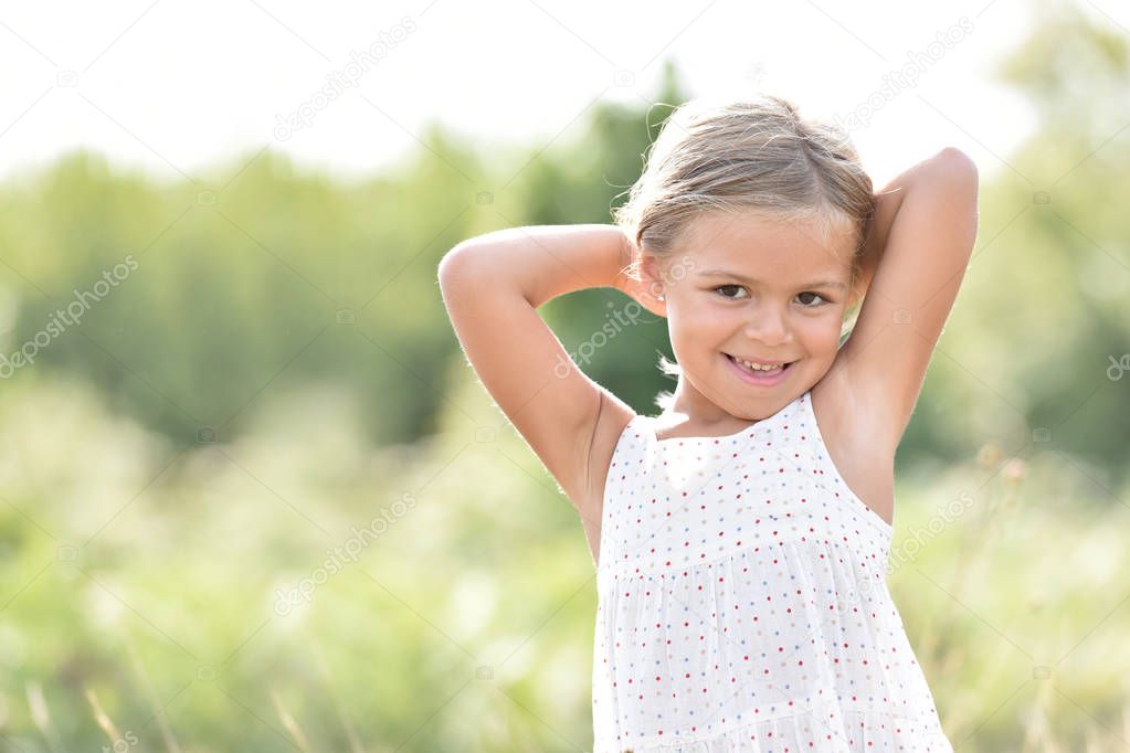  little blond girl in countryside