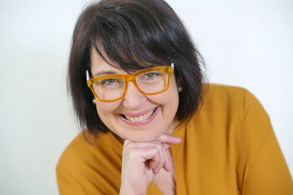 Woman with yellow eyeglasses on — Stock Photo, Image