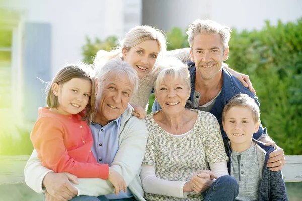 Portrait of intergenerational family sitting — Stock Photo, Image