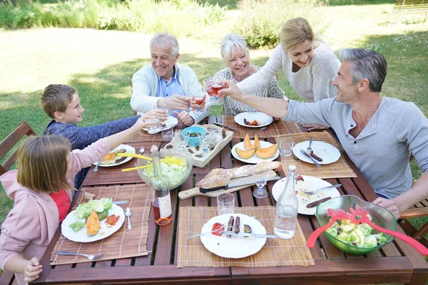 Family having summer lunch — Stock Photo, Image