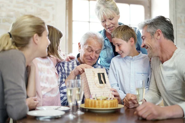 Family celebrating grandfather birthday — Stock Photo, Image