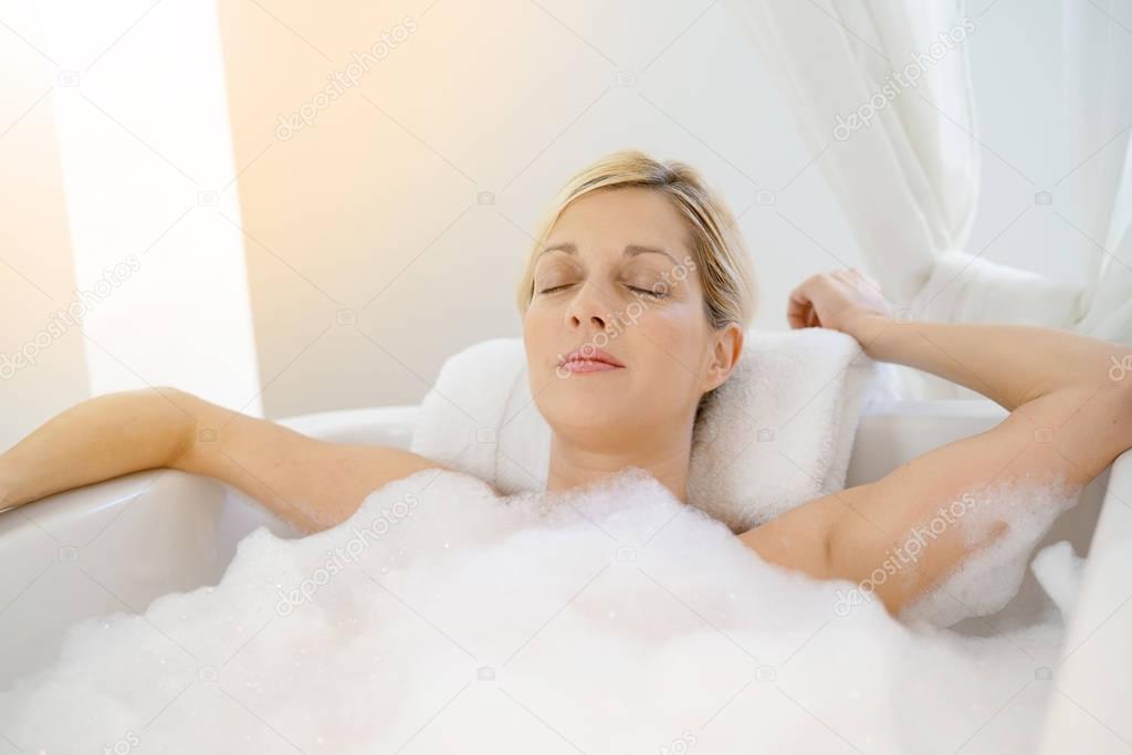  woman relaxing in bathtub