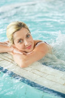 woman relaxing in  thermal water clipart