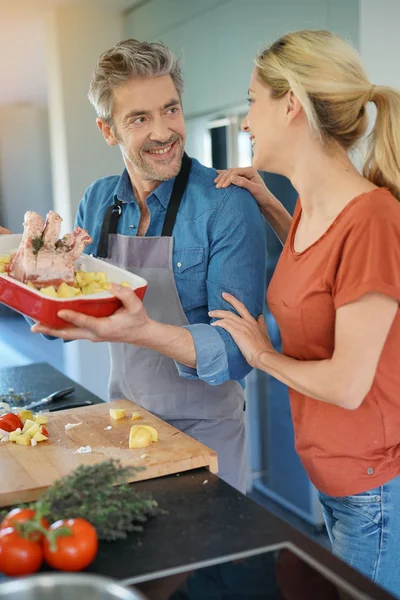 Couple having fun cooking together — Stock Photo, Image