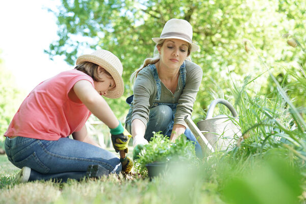 Mother and daughter gardening