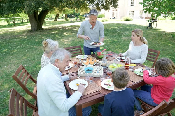 Family having summer lunch