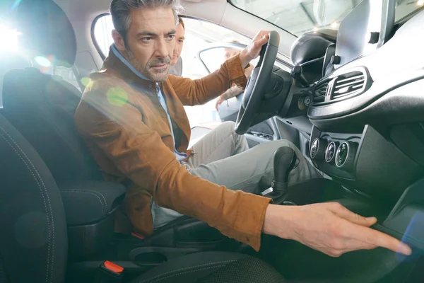 Man sitting inside vehicle — Stock Photo, Image