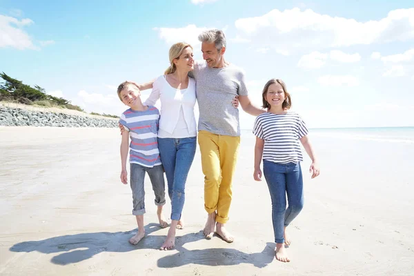 Familywalking on sandy beach — Stock Photo, Image