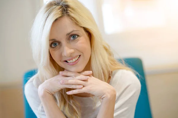 Blond woman relaxing at home — Stock Photo, Image