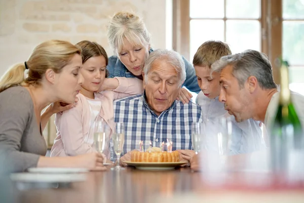 Family celebrating grandfather birthday — Stock Photo, Image