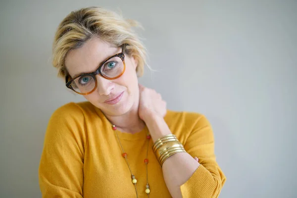 blond woman with eyeglasses