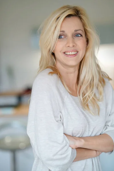 Cheerful middle-aged blond woman — Stock Photo, Image