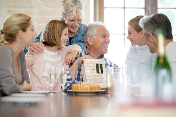 Family celebrating grandfather birthday — Stock Photo, Image